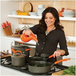 Rachael Ray Hard Anodized II Cookware Set W/ Orange Handles: 14pc -Le Creuset sales rachael ray evoo bottles in use kitchen setting compressed 6